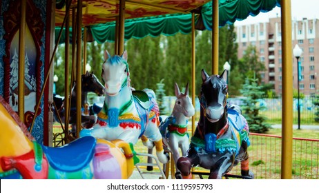 Outdoor Colourful Vintage Flying Horse Carousel In The Park
