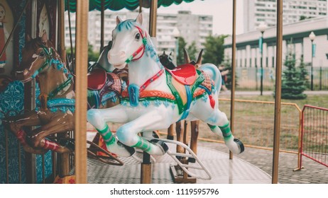 Outdoor Colourful Vintage Flying Horse Carousel In The Park
