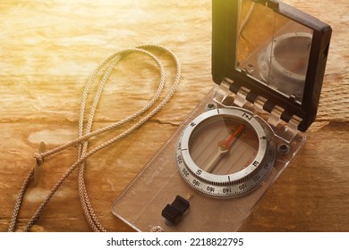 Outdoor Compass On Wood With Sun Flare