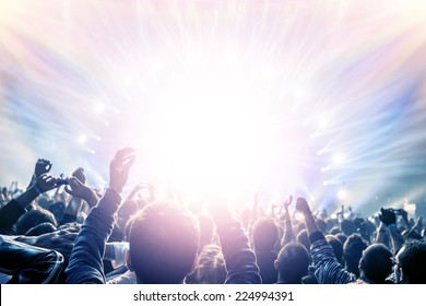 Outdoor concert, happy people with raised up hand enjoying night in the club, night entertainment, active lifestyle, New Year celebration, partying concept