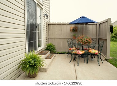 Outdoor Condo Dining Area with Boston Ferns