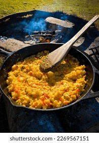Outdoor cooking scrambled eggs on open fire - Shutterstock ID 2269567151