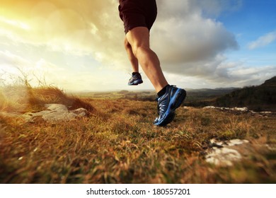 Outdoor cross-country running in early sunrise concept for exercising, fitness and healthy lifestyle - Powered by Shutterstock