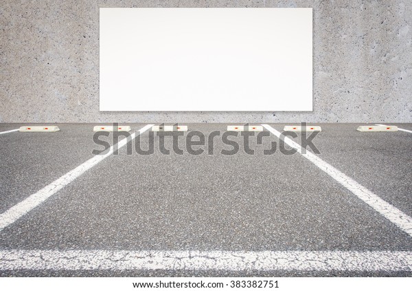 Outdoor empty\
car parking lot  with blank\
billboard