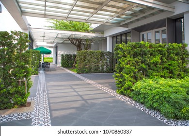 Outdoor Empty Corridor With Garden In The Modern Office Building.