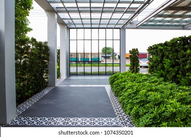 outdoor empty corridor with garden in the modern office building.