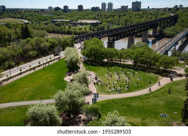 Outdoor exercise or Yoga class in Edmonton Alberta Canada.   Park beside scenic High Level Bridge over North Saskatchewan river