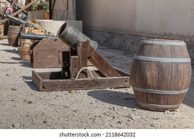 outdoor exhibition of different ancient cannons and powder kegs. outdoors photograph taken in the recreation of a military camp of the XVI century