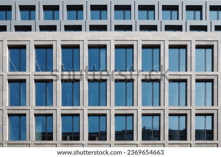 Outdoor exterior front view of modern facade with typical rectangular open and close windows.