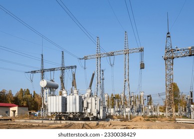 The outdoor extra high voltage power transformer. A high-voltage power electrical substation.