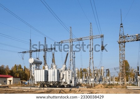 The outdoor extra high voltage power transformer. A high-voltage power electrical substation.