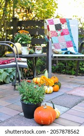 Outdoor Fall Patio Setting With Autumn Harvest Decor For Cozy Drinks. 