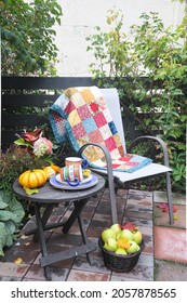 Outdoor Fall Patio Setting With Autumn Harvest Decor For Cozy Drinks. 