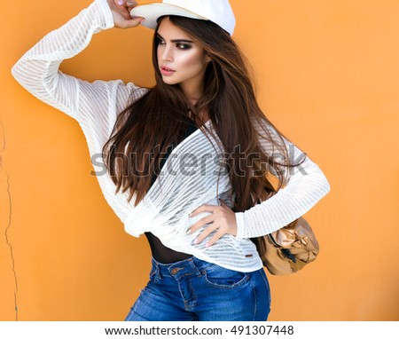 Similar – Woman with sunglasses looking at camera over garden fence