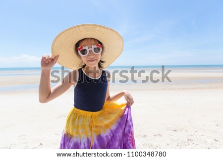 Outdoor fashion photo of cute happy girl at sea,beach travel