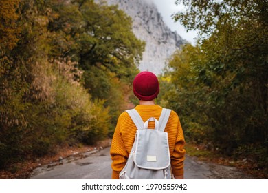 Outdoor fashion photo of young beautiful asian lady surrounded autumn forest in mountains. Portrait of romantic hipster female, Warm autumn weather, calm scene. Wanderlust photo series. - Powered by Shutterstock