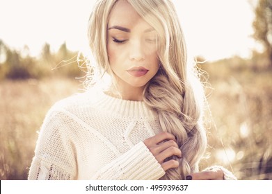 Outdoor Fashion Photo Of Young Beautiful Lady In Autumn Landscape With Dry Flowers.
Autumn/Winter. Warm Autumn/winter. Fashion Autumn/winter. Beautiful Autumn. Sunny Autumn, Cozy Autumn Sweater