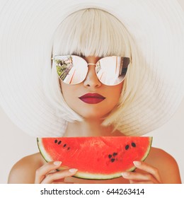 Outdoor Fashion Photo Of Young Beautiful Lady In Hat And Sunglasses With Watermelon. Summer Beach Travel. Summer Vibes