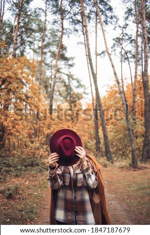 Similar – Image, Stock Photo Low angle view of blonde white girl posing in the forest with trees in the background.