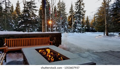 Outdoor Fire Pit In A Snowy Setting At Sunrise/Sunset; Vacation/Travel/Cozy/Fun