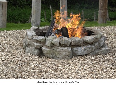 Outdoor Fireplace With Burning Fire