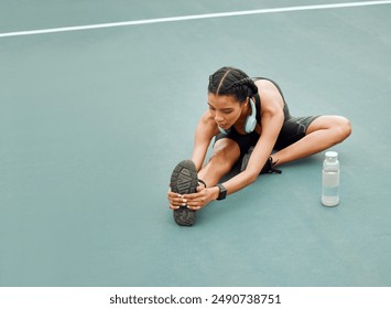 Outdoor, fitness and woman with stretching leg for morning exercise, floor or workout routine. Sport, athlete and female person with headphones for match, preparing or warm up muscles on tennis court - Powered by Shutterstock