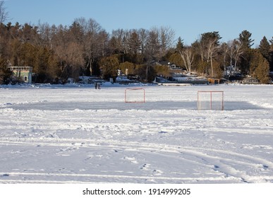 Outdoor Frozen Lake Hockey Rink In Canadian Winter