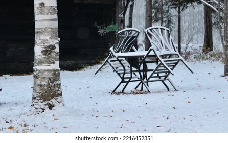 Outdoor Furniture Covered In The Frost Snow Of The Season