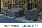 outdoor furniture covered for the season (end of year, winter) along with pool with cover (safety) chairs, sofa, couch, swimming pool, patio, back yard, stone, granite, protetive rain cover, sheath