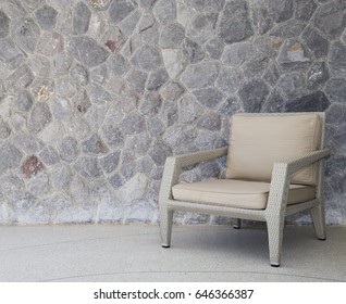 Outdoor Furniture Wicker Chair With Stone Wall