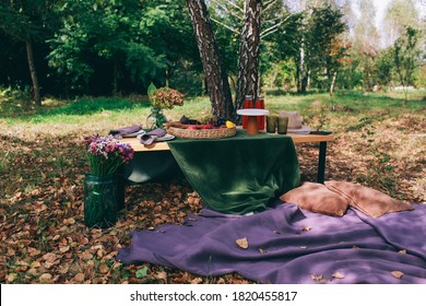 Outdoor Gender Reveal Party Decorations. Girl Or Boy. Beautiful Photo Zone With Cake And Fruits.
Autumn Decor With Purple And Green Color. Two Glasses Of The Red Wine And Tasty Food And Accessories 