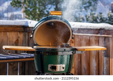 Outdoor Grilling On The Balcony At A Sunny Cold Winter Day