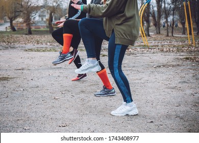 Outdoor Gym Fitness Classes, Outside Workout. Fitness In The Fresh Air. Safer Outside. Group Fitness Classes, HIIT Training, Run Clubs, Strength Circuits. Close Up Sportswoman Legs.