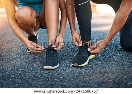 Outdoor, hands and tie shoes in road ready for fitness, exercise and training for wellness or health. Couple, sneakers and people fixing lace on street ground, nature and before running for sports