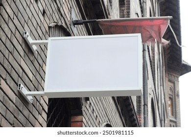 Outdoor hanging mounted sign on the wall mockup template. Signboard mock up for logo presentation.