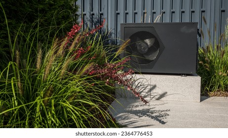 Outdoor heat pump unit for heating a swimming pool. - Powered by Shutterstock