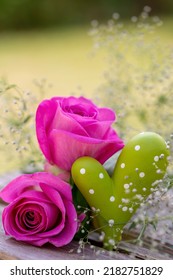 Outdoor Holiday Decoration With Pink Roses And Green Heart