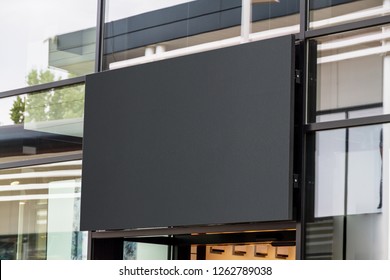 Outdoor horizontal sign on shop front window mockup