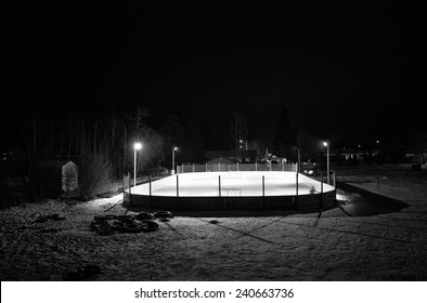 Outdoor Ice Hockey Rink At Night In Black And White