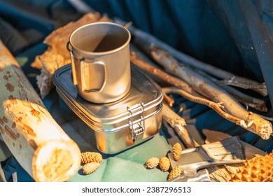 Outdoor kitchen equipment camp fire and brewing tea pot moka coffee drip cup,with wooden table camping gas stove set in nature outdoor,mountain background,concept camp and travel - Powered by Shutterstock