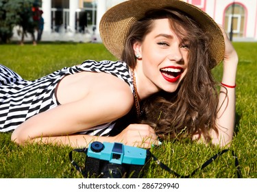 Outdoor Lifestyle Portrait Of Stylish Girl Laughing And Smiling Holding Retro Camera.Beautiful Sexy Woman,evening Makeup Wearing Short Dress,summer Fall Collection Perfect In Park Sun Shine,top Skirt