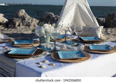 An Outdoor Luxury Picnic Setting On The Beach In Miami, Florida