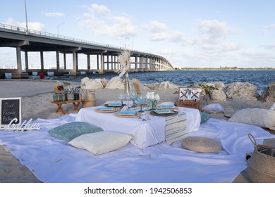 An Outdoor Luxury Picnic Setting On The Beach In Miami, Florida