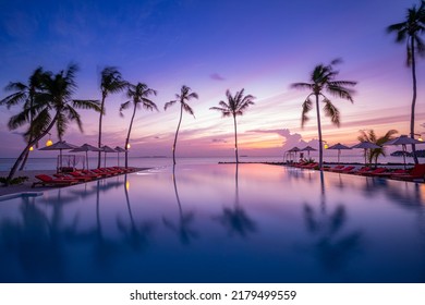 Outdoor luxury sunset over infinity pool swimming summer beachfront hotel resort, tropical landscape. Beautiful tranquil beach holiday vacation background. Amazing island sunset beach view, palm trees - Shutterstock ID 2179499559