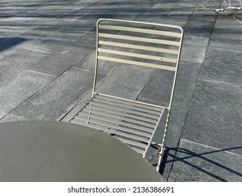 Outdoor Metal Table And A Chair. Urban Setting