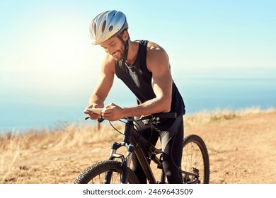 Outdoor, mobile and man with mountain bike for adventure, fitness or prepare for competition. Nature, male cyclist or bicycle with cellphone for social media, chat or training for marathon challenge - Powered by Shutterstock