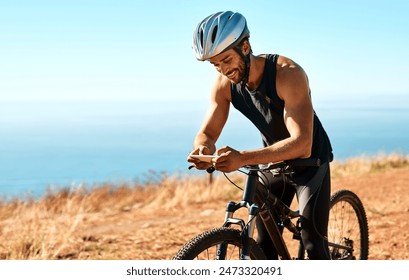 Outdoor, mobile and man with mountain bike for fitness, adventure or prepare for competition. Nature, male cyclist or bicycle with cellphone for social media, chat or training for marathon challenge - Powered by Shutterstock