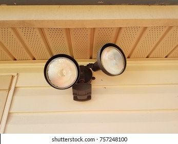 Outdoor Motion Sensor Flood Light Under The Eaves Of A House