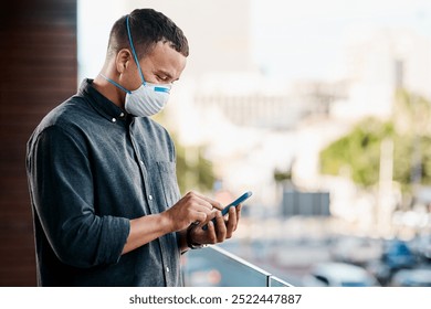 Outdoor, pandemic or businessman with mobile, mask and research for covid awareness or flu season. Social media, virus or employee on balcony with network app, phone notification or healthcare news - Powered by Shutterstock