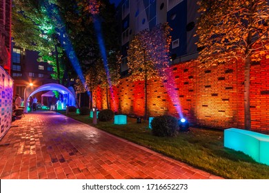 Outdoor Party With Night Lighting. Landscape Spot Lighting At The Back Yard Party